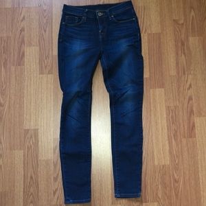 Dark blue mid rise skinny jeans